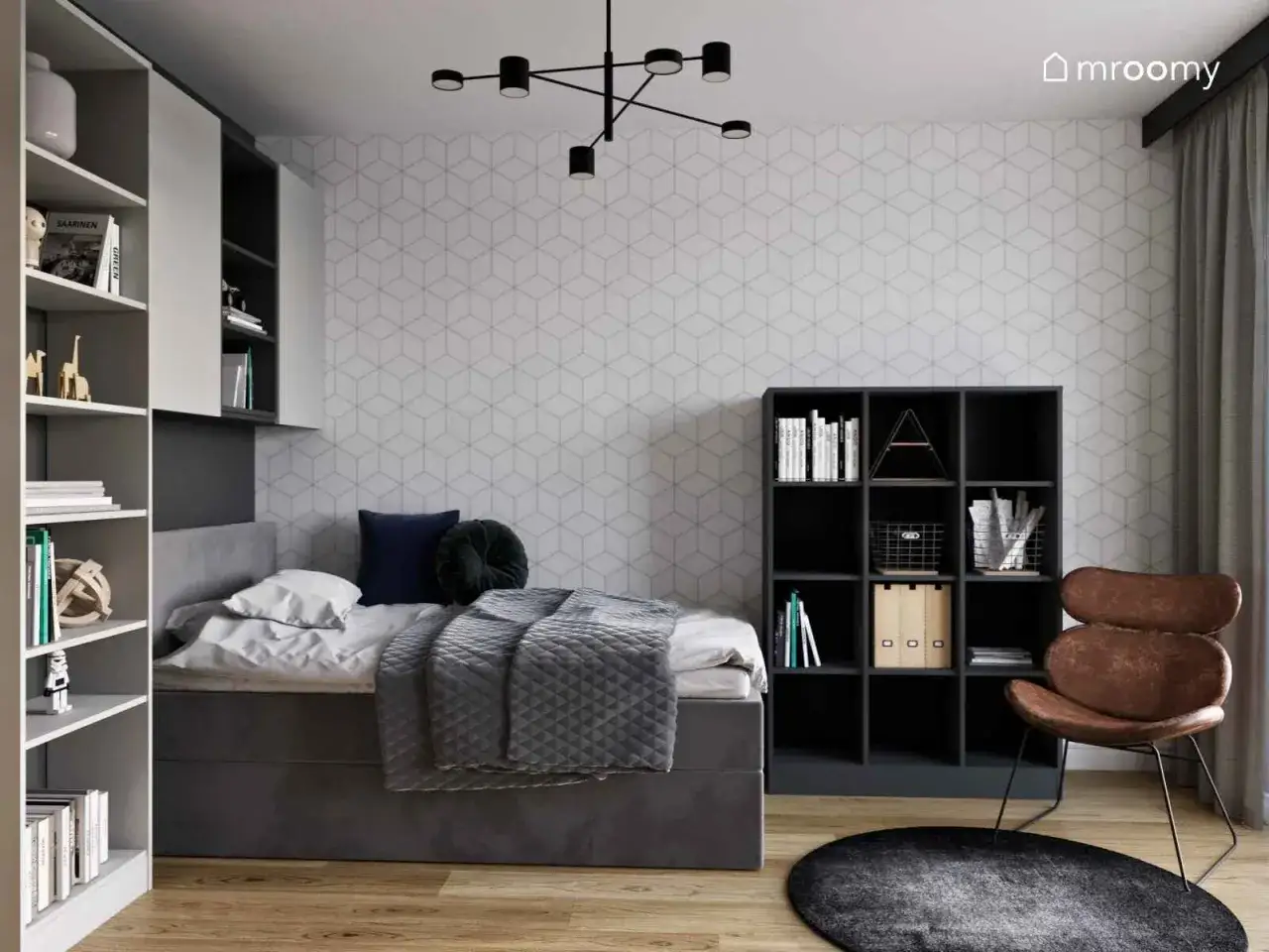 Nowoczesne ściany w pokoju młodzieżowym z geometrycznym wzorem. Wygodne łóżko, regały z książkami i stylowy fotel tworzą przytulną przestrzeń.